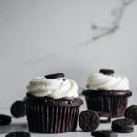 white and brown cupcakes on white table